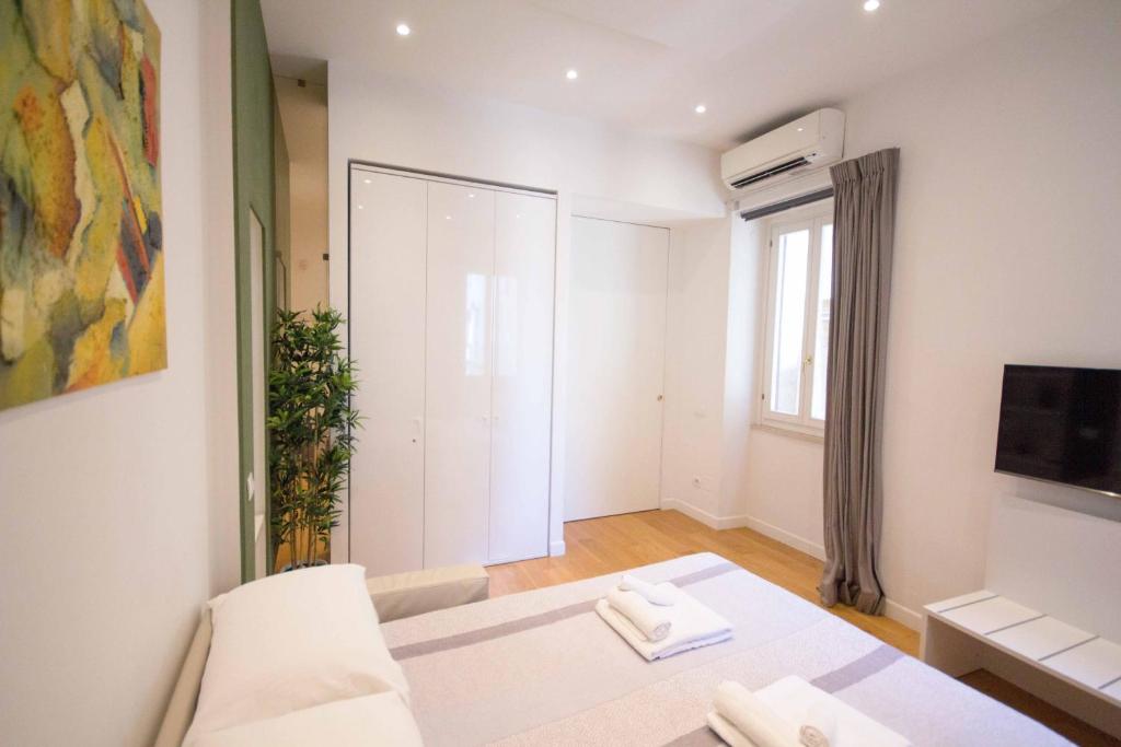 A bed or beds in a room at Corso 277 Apartment