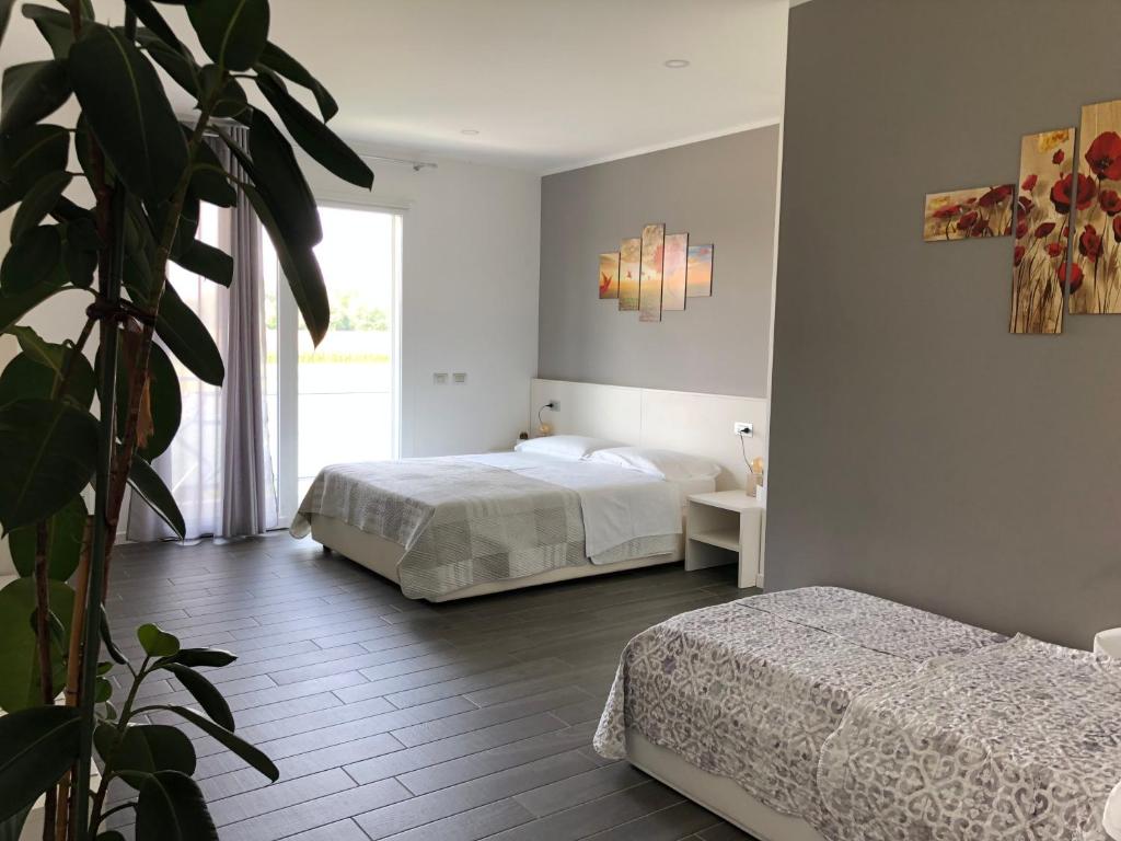 Postel nebo postele na pokoji v ubytování B&B Villa del Lago