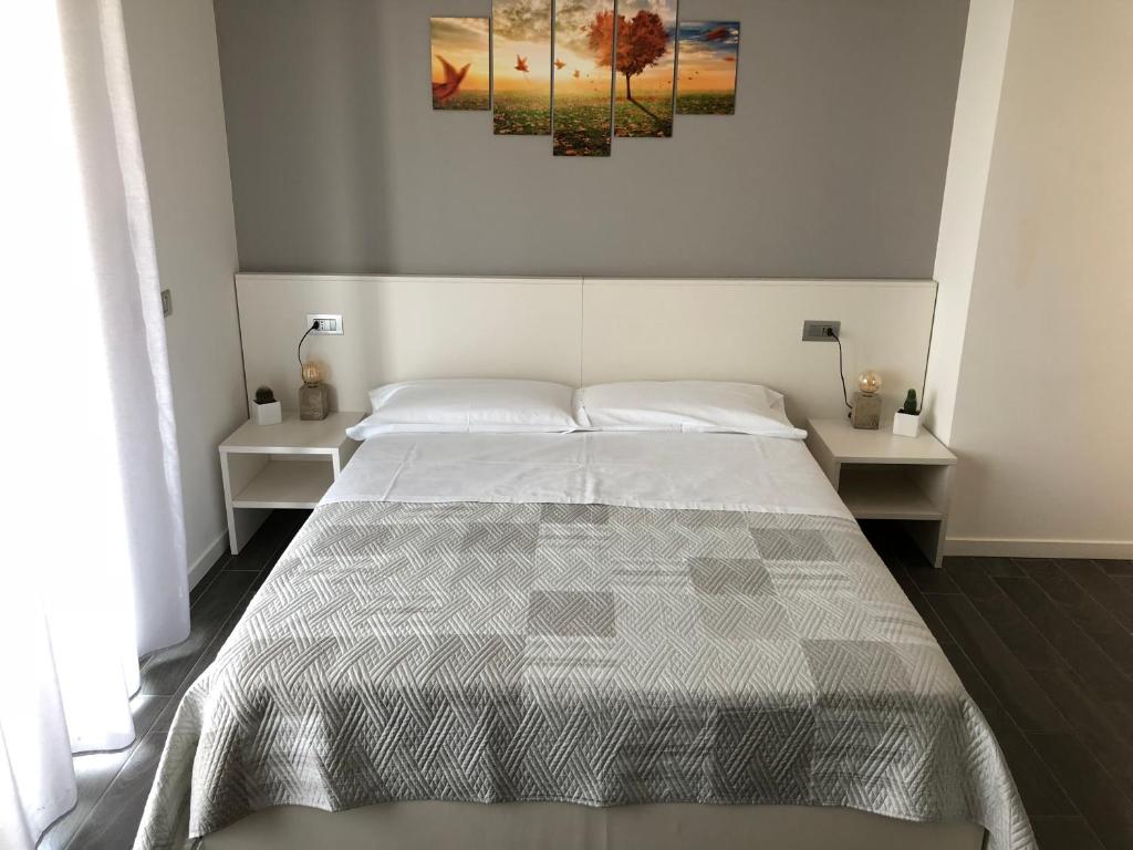 Postel nebo postele na pokoji v ubytování B&B Villa del Lago
