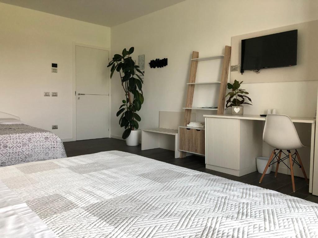 Postel nebo postele na pokoji v ubytování B&B Villa del Lago