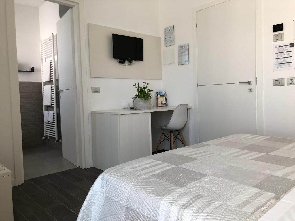 Postel nebo postele na pokoji v ubytování B&B Villa del Lago