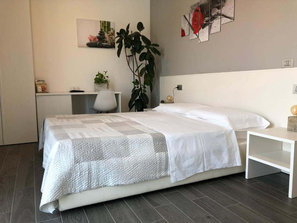 Postel nebo postele na pokoji v ubytování B&B Villa del Lago