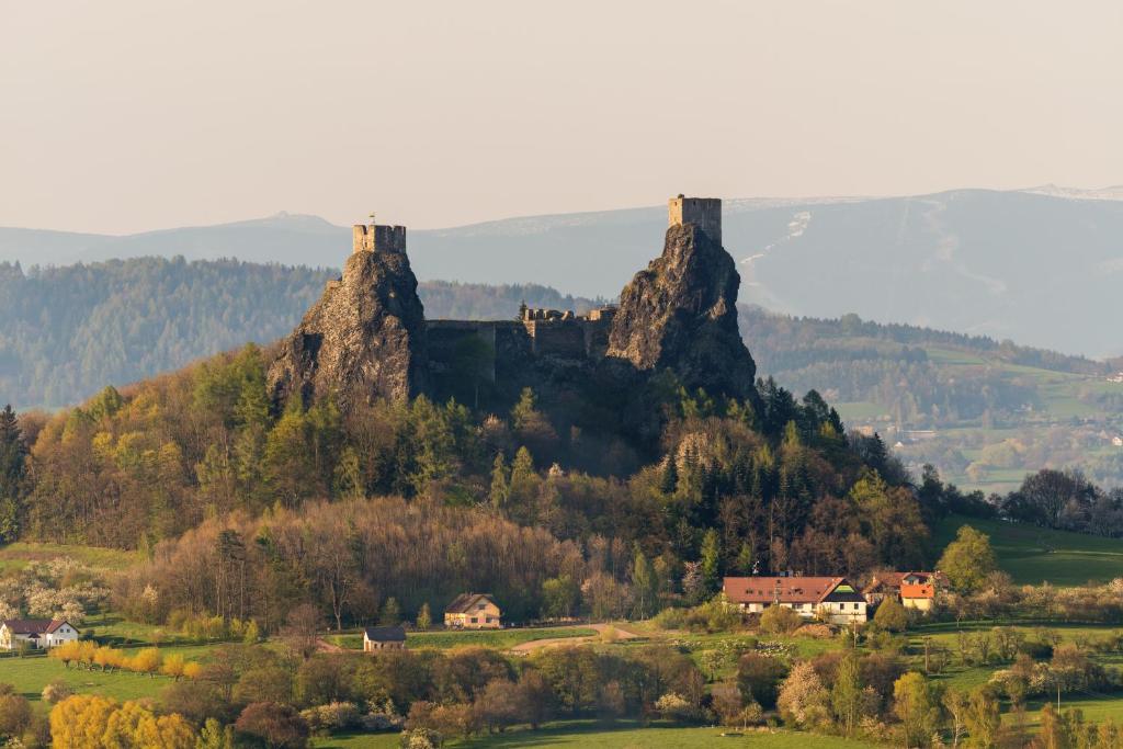 a view of a mountain with two towers at Hotel Trosky in Troskovice