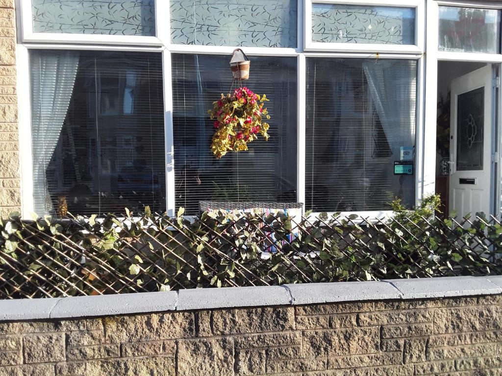 a wreath is hanging in front of a house at The Weeton guesthouse in Blackpool