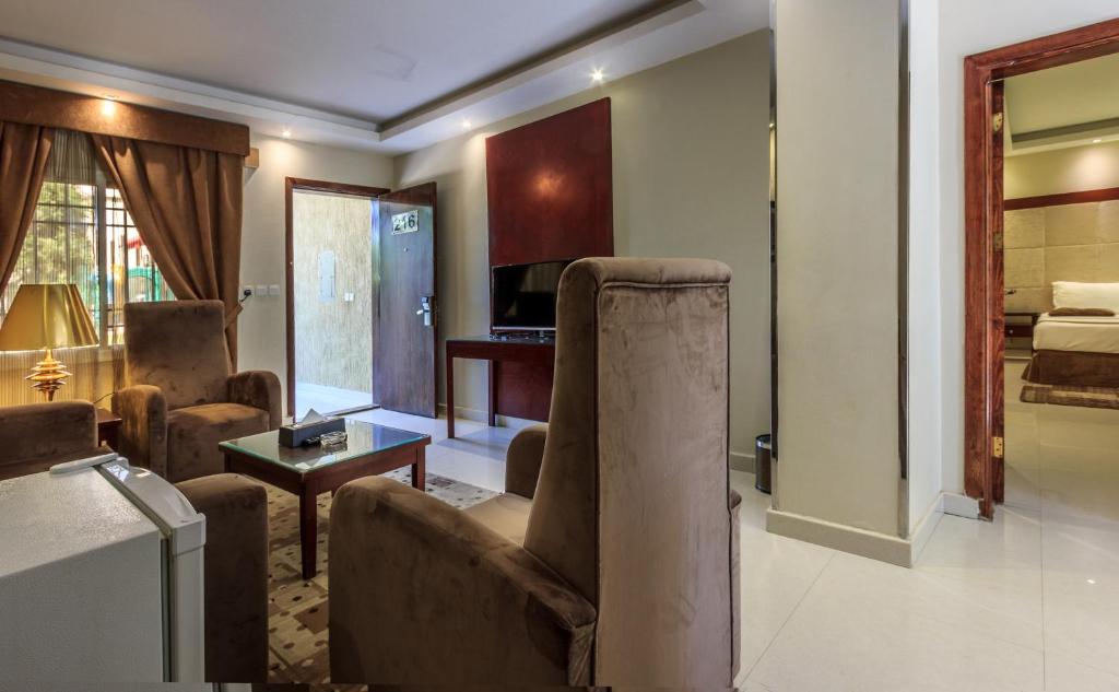 Postel nebo postele na pokoji v ubytování Al Muhaidb Residence for Chalets and Holidays Homes المهيدب ريزدنس لبيوت العطلات