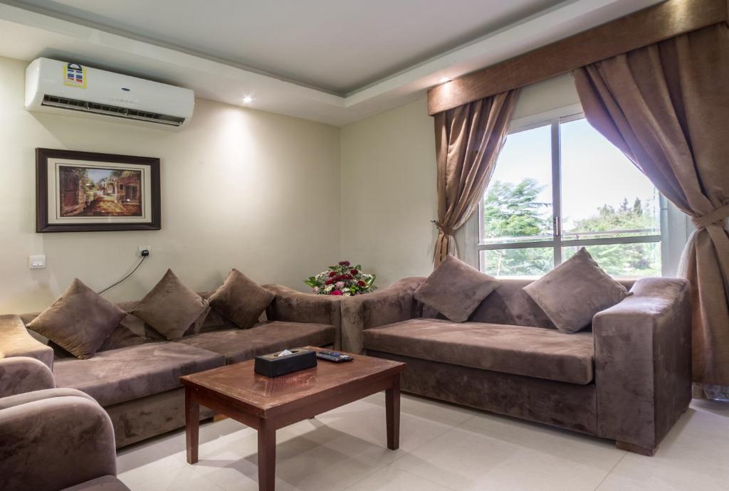 Posezení v ubytování Al Muhaidb Residence for Chalets and Holidays Homes المهيدب ريزدنس لبيوت العطلات