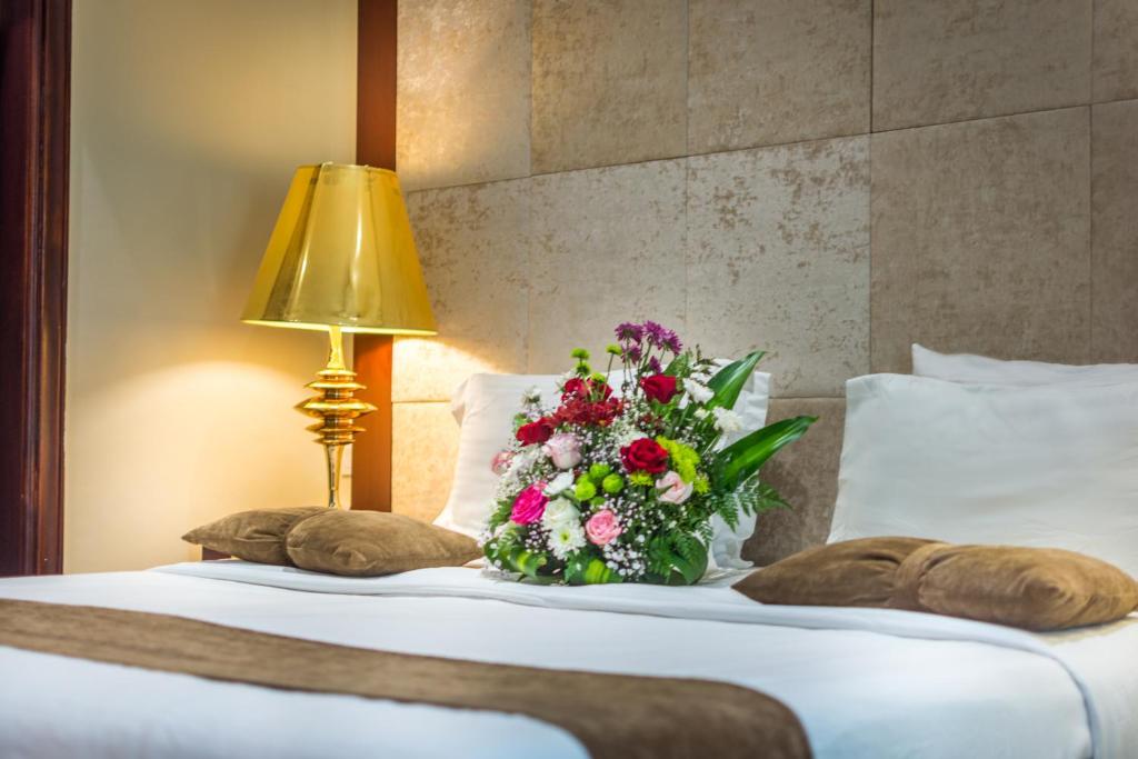 Postel nebo postele na pokoji v ubytování Al Muhaidb Residence for Chalets and Holidays Homes المهيدب ريزدنس لبيوت العطلات