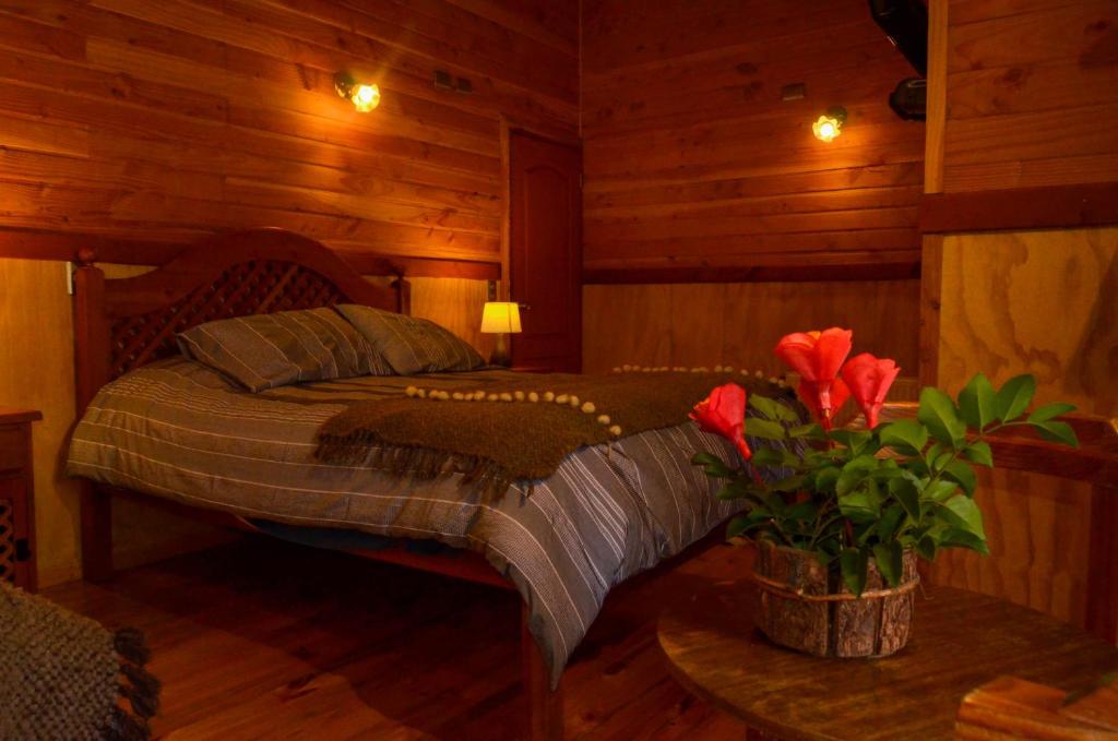 Postel nebo postele na pokoji v ubytování Hostal Pucon Sur