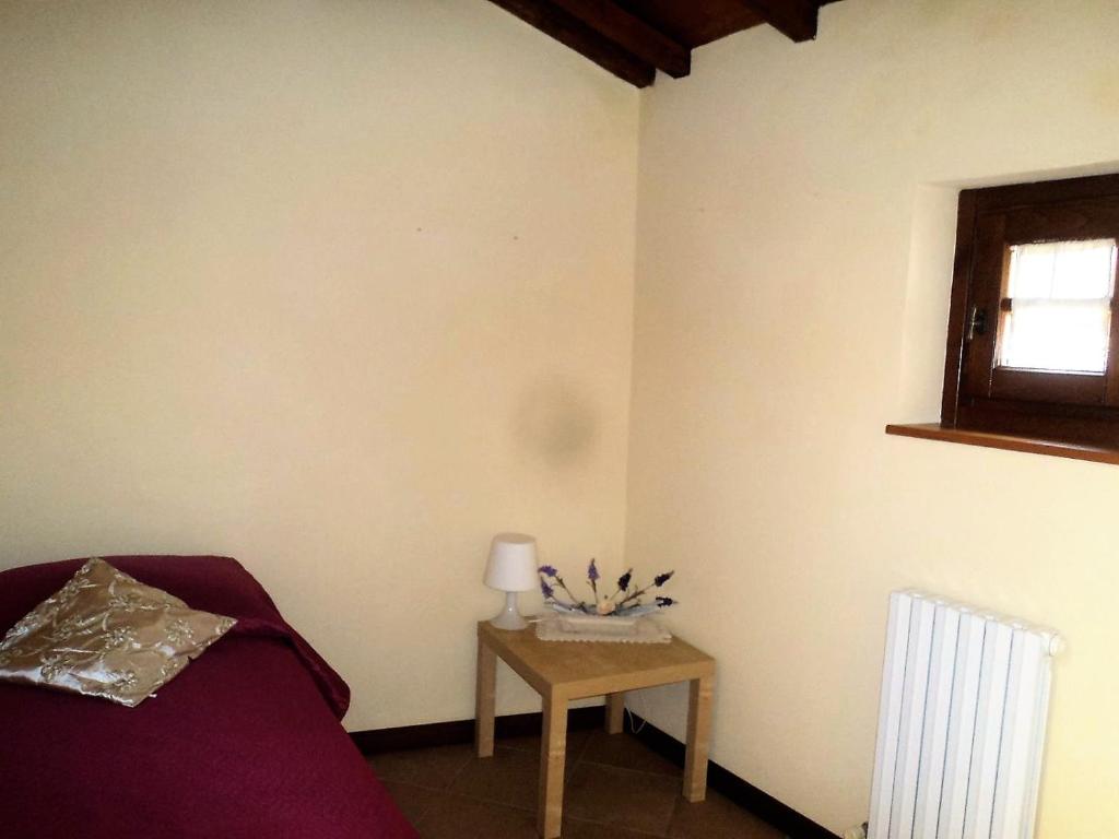 A bed or beds in a room at La Tana Nel Castelvecchio
