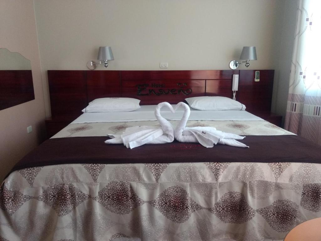 Tempat tidur dalam kamar di Hotel El Ensueño