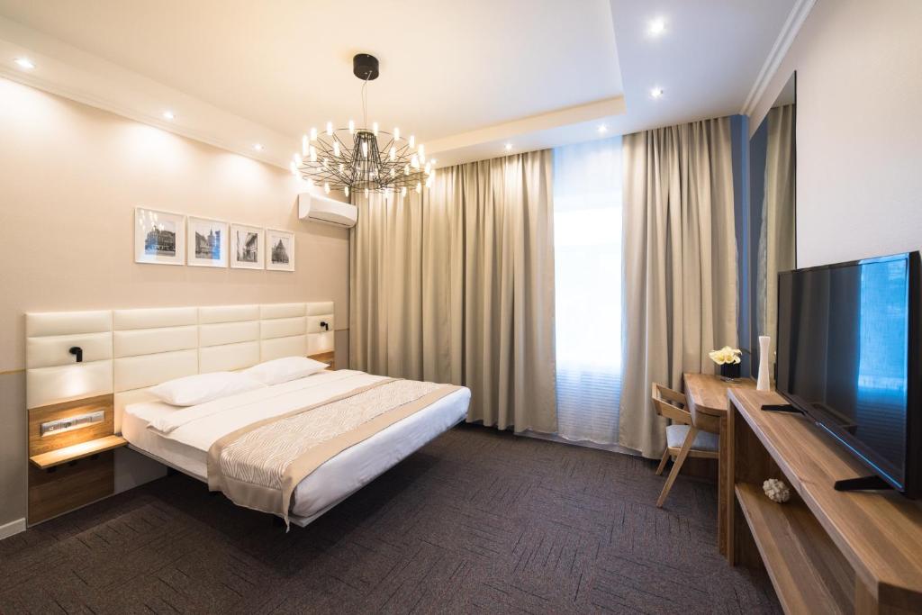 
Кровать или кровати в номере Hotel KamInn
