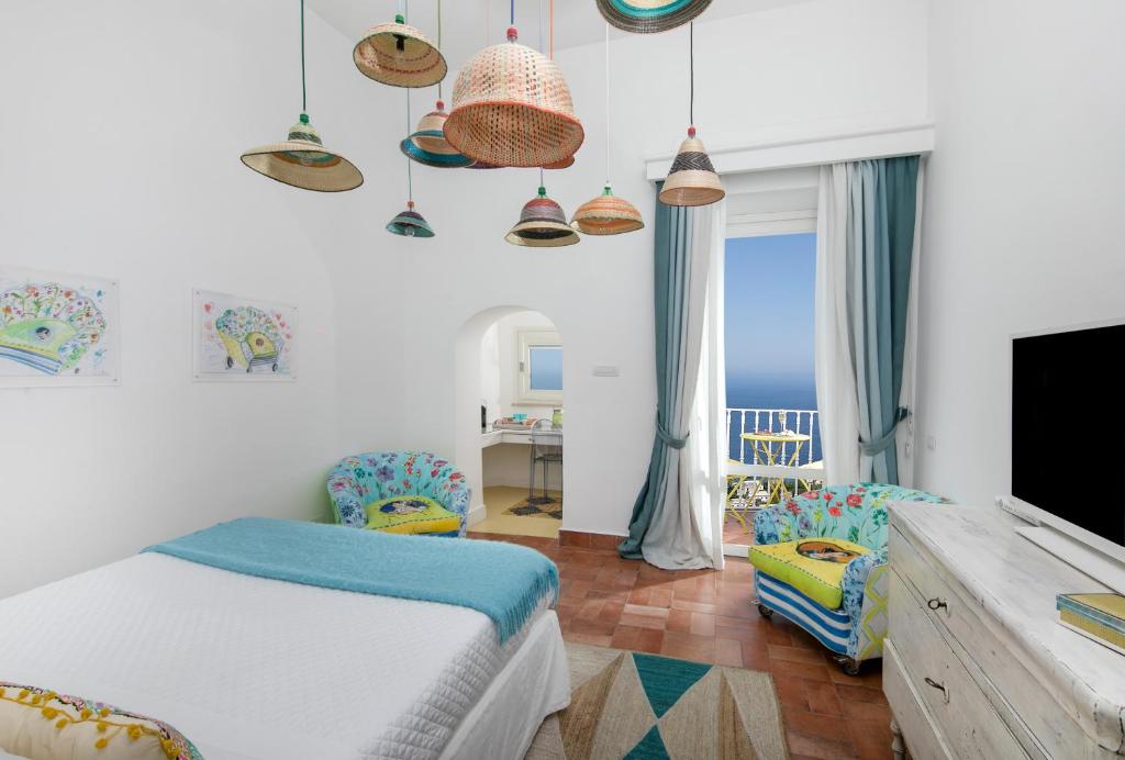 Postel nebo postele na pokoji v ubytování Casa Marta Capri
