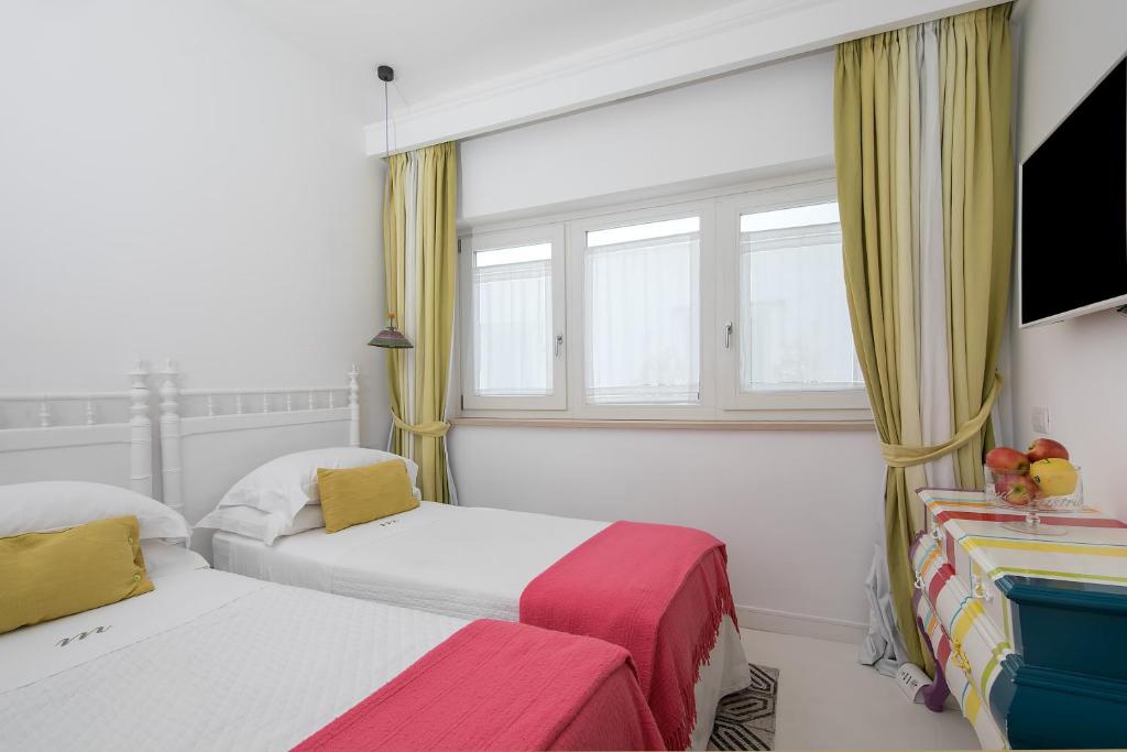Postel nebo postele na pokoji v ubytování Casa Marta Capri
