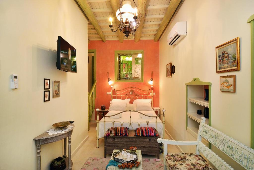 a bedroom with a bed in the middle of a room at Casa della Favola Boutique Hotel in Chania
