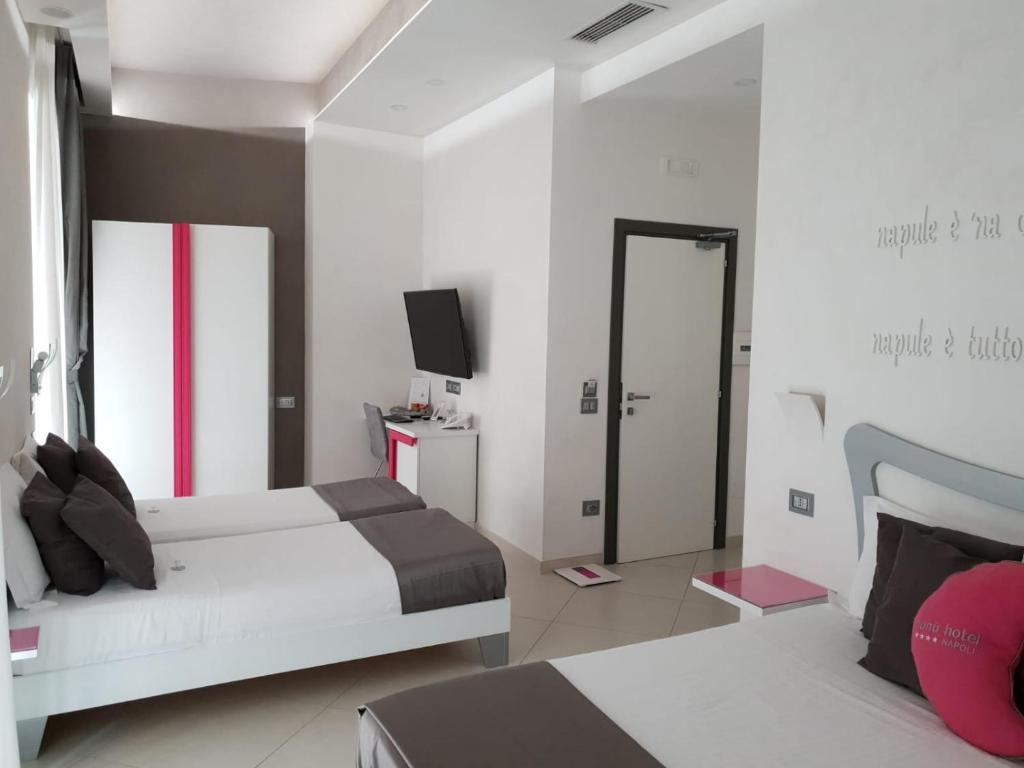 Postel nebo postele na pokoji v ubytování Hotel Nunù