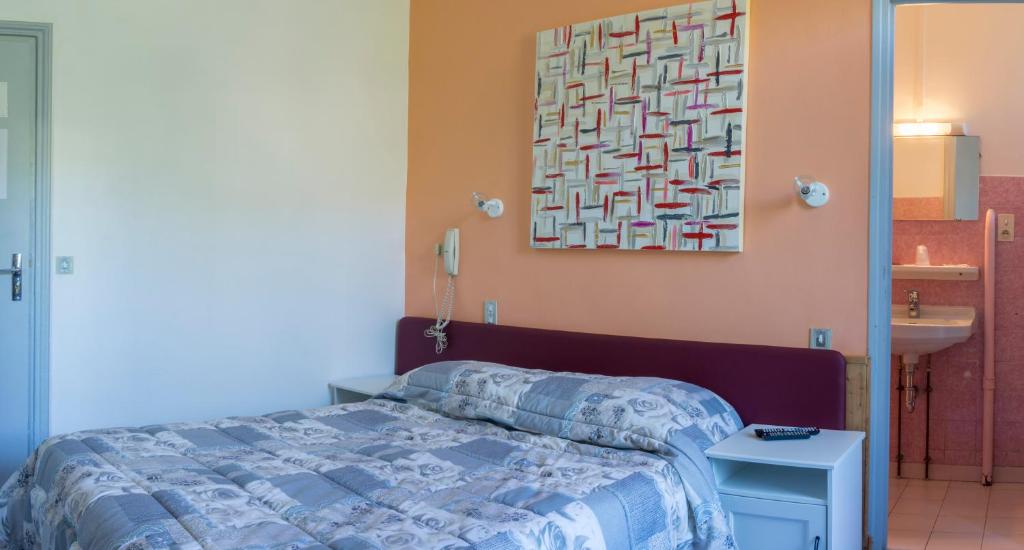 Postel nebo postele na pokoji v ubytování Hôtel De Paris