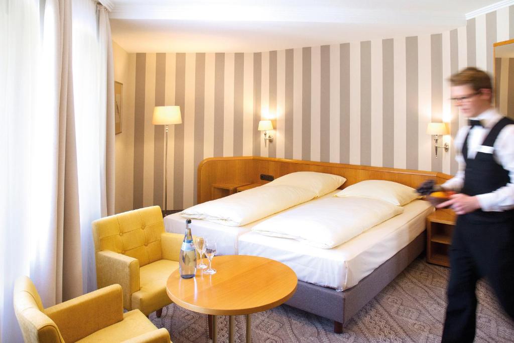Postel nebo postele na pokoji v ubytování Hotel Reichsküchenmeister