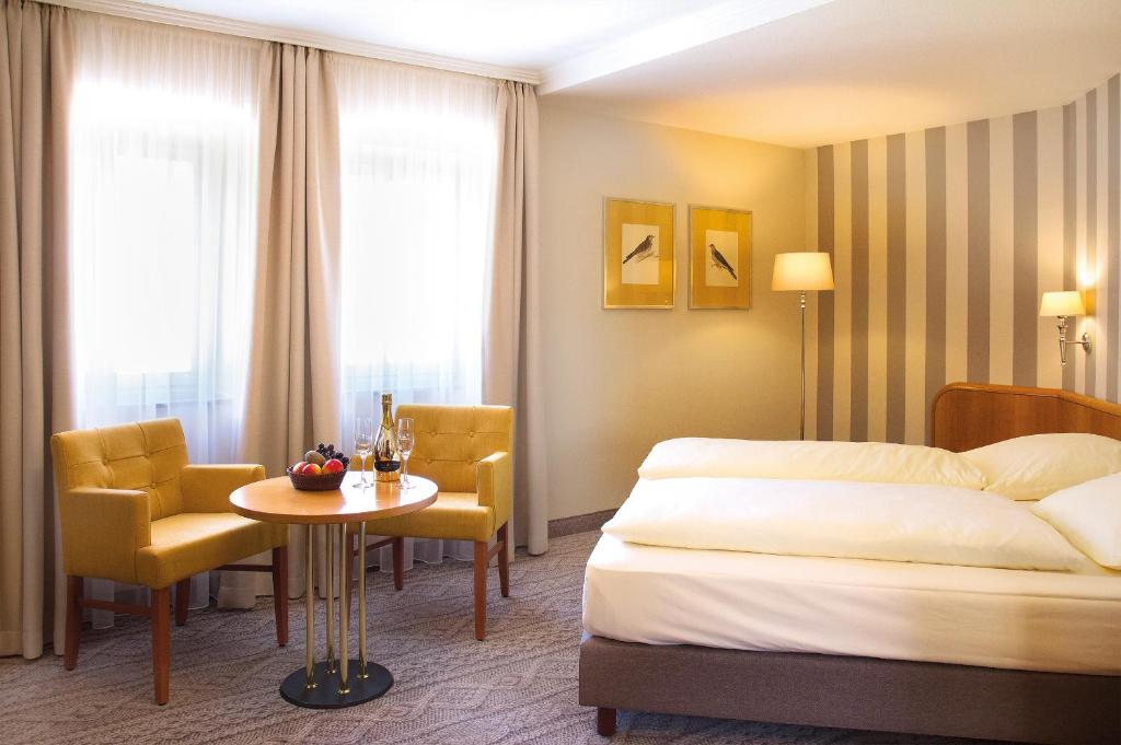 Postel nebo postele na pokoji v ubytování Hotel Reichsküchenmeister