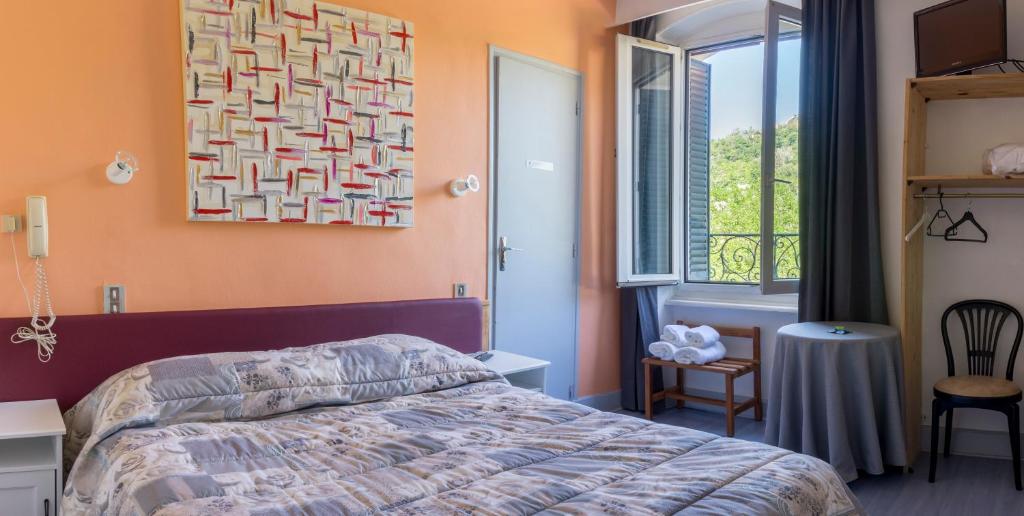 Postel nebo postele na pokoji v ubytování Hôtel De Paris