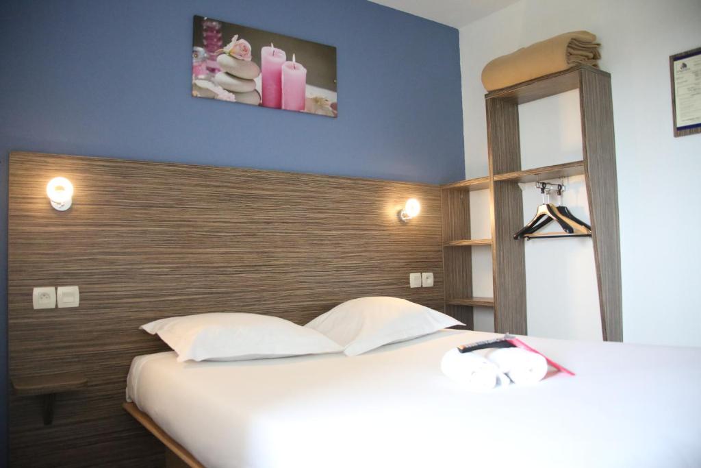 Postel nebo postele na pokoji v ubytování Fasthotel Lens Noyelles Godault