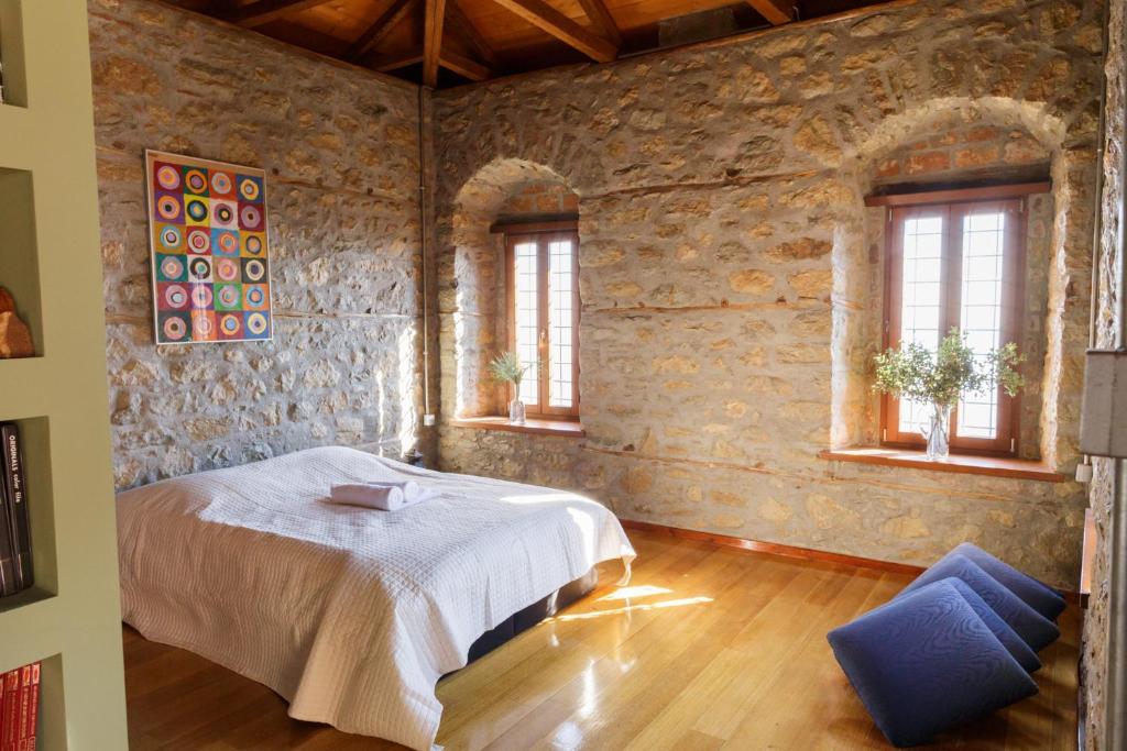 A bed or beds in a room at Cottage House in Traditional Greek Village