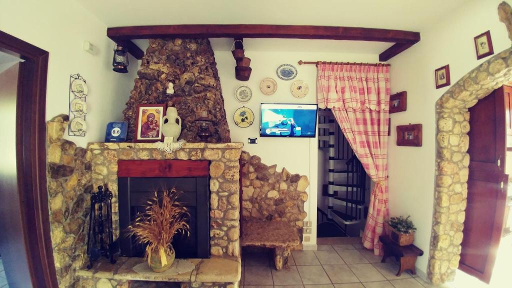 TV a/nebo společenská místnost v ubytování Villa Frantoio