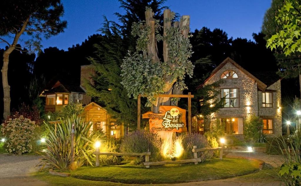 a house with a halloween sign in front of it at Cabanas Luces el Bosque in Mar de las Pampas