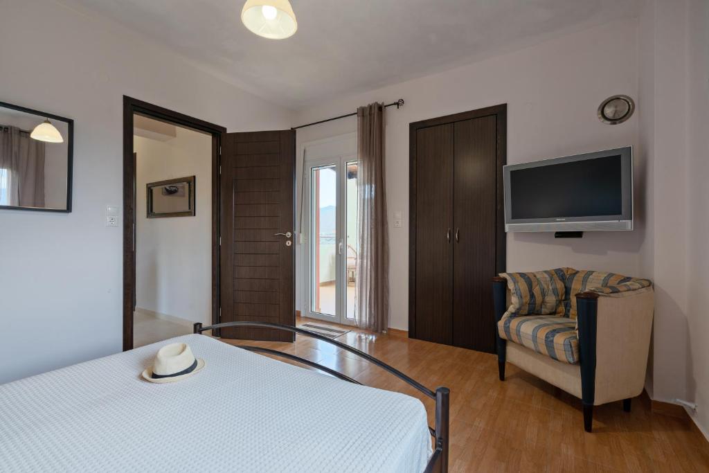 Łóżko lub łóżka w pokoju w obiekcie Aliki Serenity Cottage