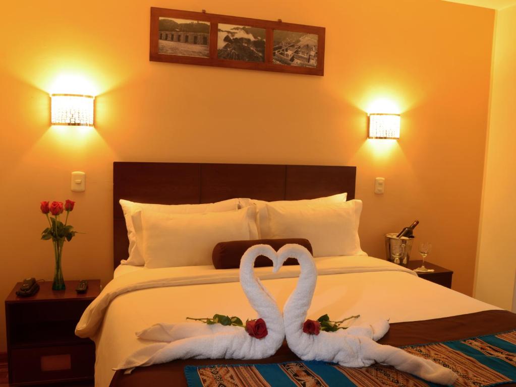 Postel nebo postele na pokoji v ubytování Kapac Inn Hotel
