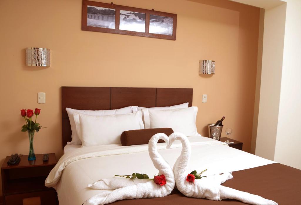 Postel nebo postele na pokoji v ubytování Kapac Inn Hotel