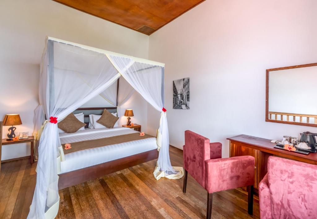 Postel nebo postele na pokoji v ubytování Azao Resort & Spa