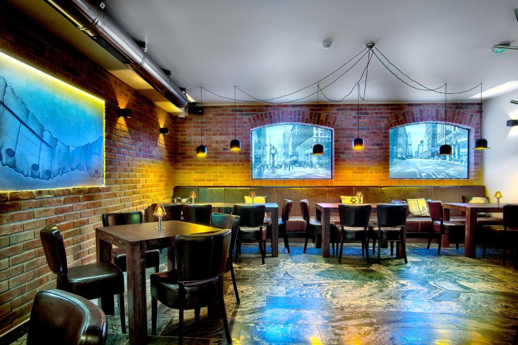 Televízia a/alebo spoločenská miestnosť v ubytovaní BoutiqueHotel Aristo