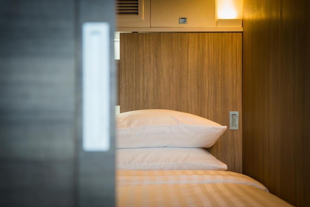 Postel nebo postele na pokoji v ubytování Nonze Hostel