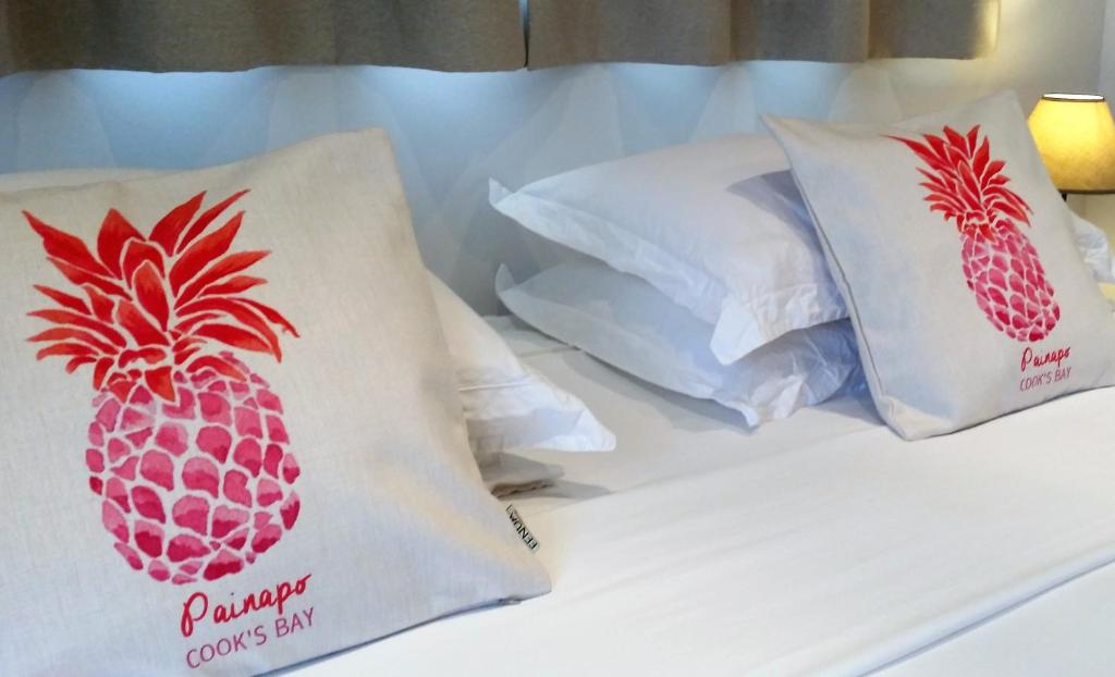 Postel nebo postele na pokoji v ubytování Fare Suisse Tahiti - Guesthouse