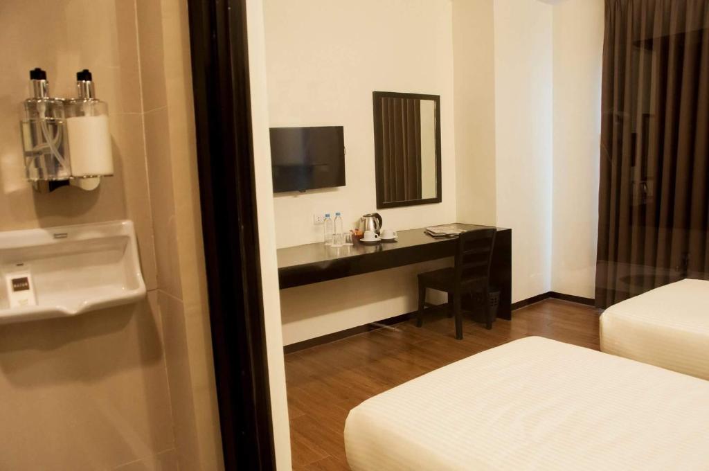 Postel nebo postele na pokoji v ubytování Piña Suites