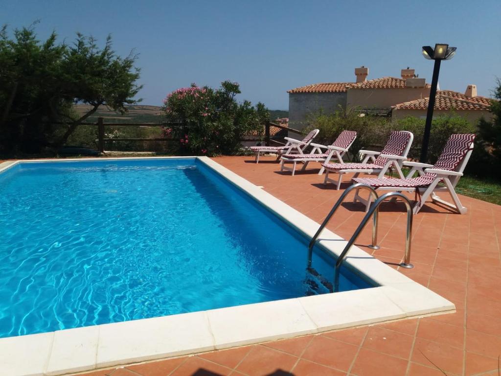 The swimming pool at or close to Villa con Piscina Stintino