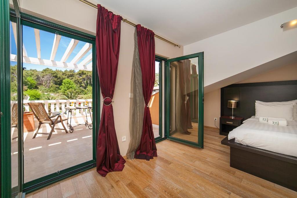 Postel nebo postele na pokoji v ubytování Apartments Grifone Lux