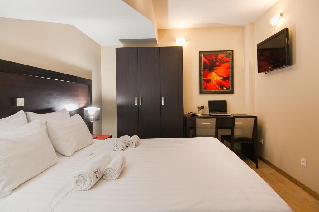 Postel nebo postele na pokoji v ubytování Apartments Grifone Lux