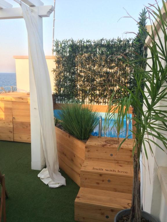an outdoor area with a pool and plants at Dimore di Mare in San Pietro Vernotico