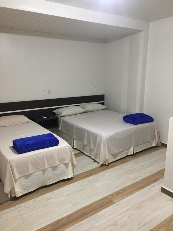 Postel nebo postele na pokoji v ubytování Hotel Paradizzo