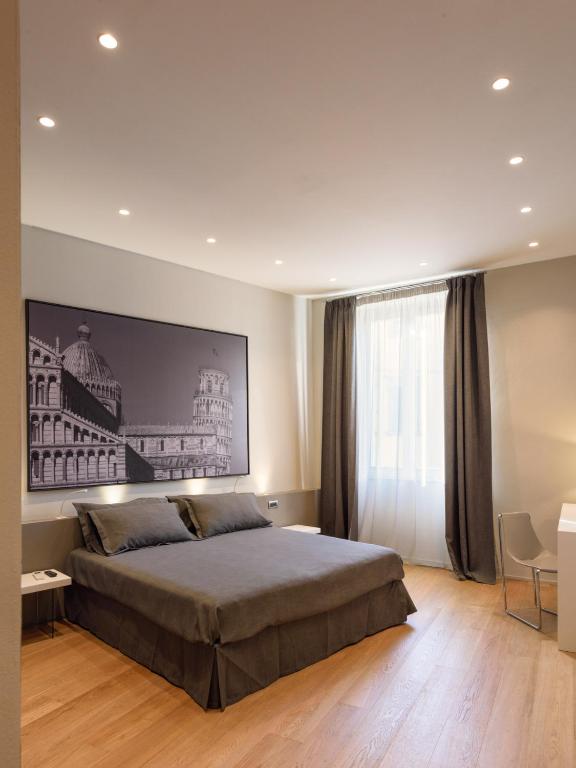 Palazzo Vasarri - Luxury design suitesにあるベッド