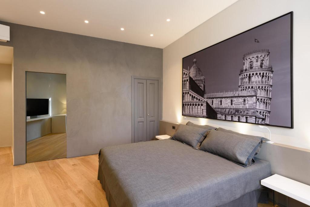 Palazzo Vasarri - Luxury design suitesにあるベッド