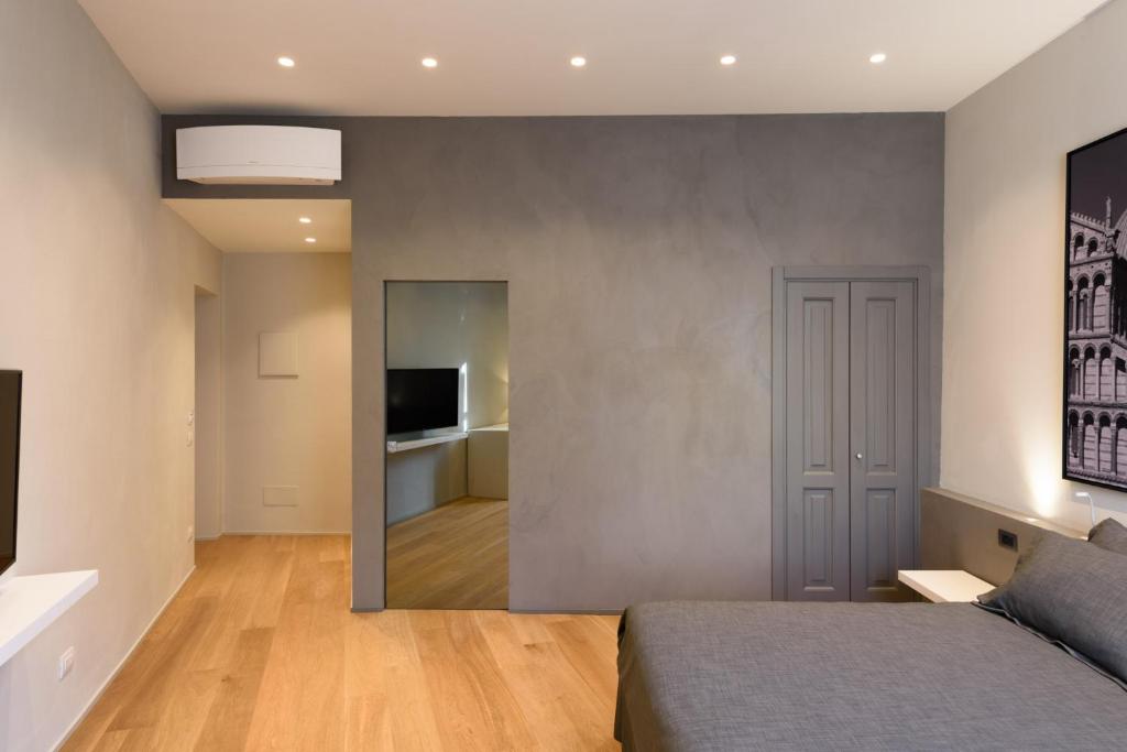 Palazzo Vasarri - Luxury design suitesにあるテレビまたはエンターテインメントセンター