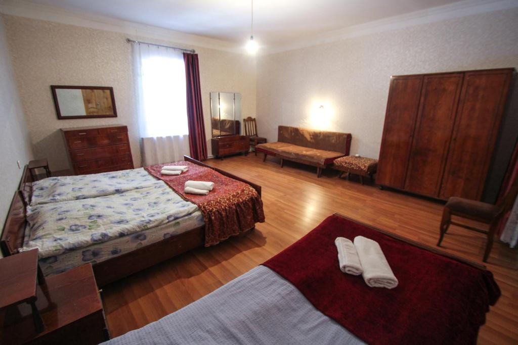 Postel nebo postele na pokoji v ubytování Eka&Nino GuestHouse