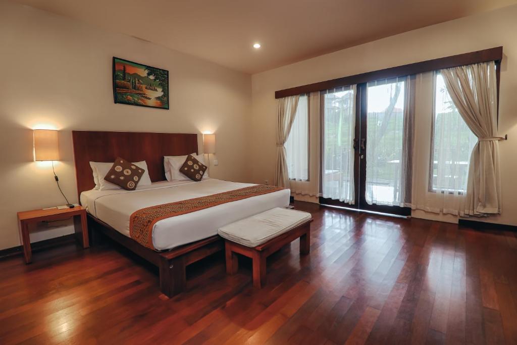 Postel nebo postele na pokoji v ubytování Biyukukung Suite & Spa
