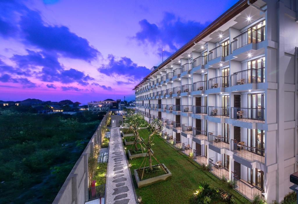 an exterior view of a building at dusk at Eastin Ashta Resort Canggu in Canggu