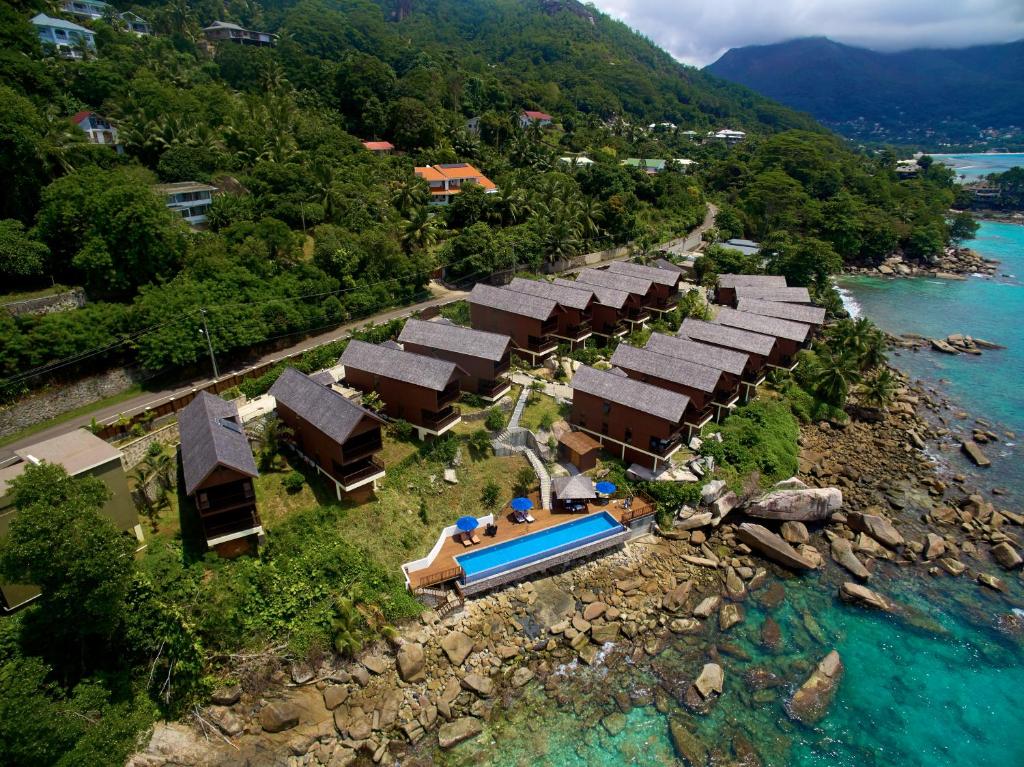 an aerial view of a resort next to the water at Oceanica Resort Seychelles in Glacis