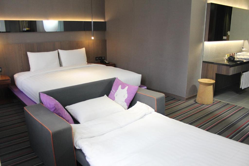 Postel nebo postele na pokoji v ubytování WESTGATE Hotel