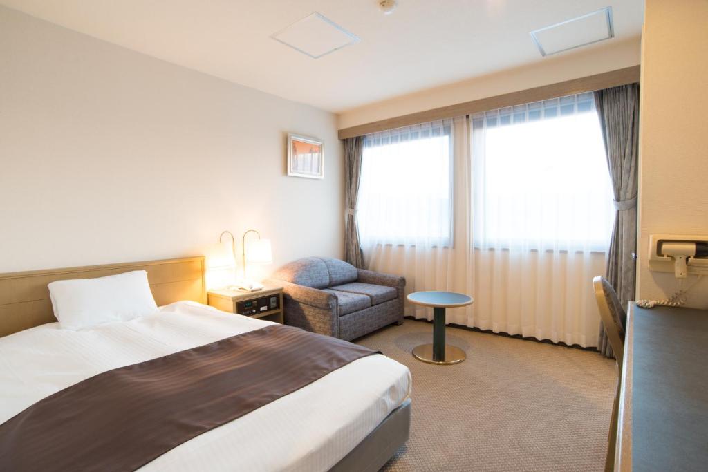 Postel nebo postele na pokoji v ubytování Hotel Suncrest