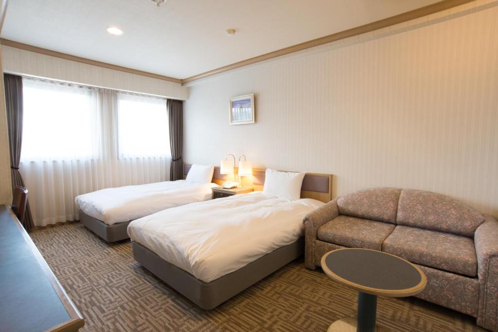 Postel nebo postele na pokoji v ubytování Hotel Suncrest
